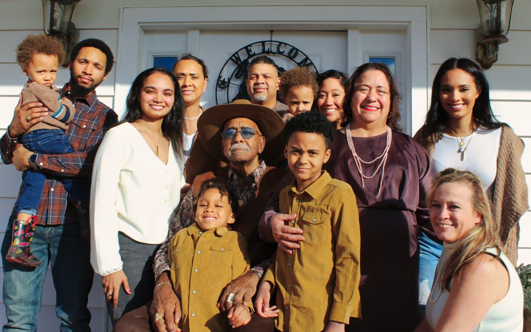 A group photo containing mixed-race families.